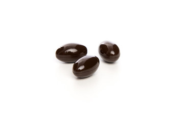 black pills on white background