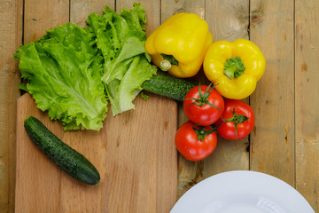 Vegetable salad with tomatoes, yellow pepper, cucumbers