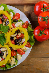 Vegetable salad with tomatoes, chinese cabbage, cheese, yellow pepper