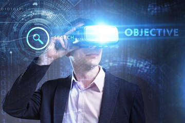 Business, Technology, Internet and network concept. Young businessman working in virtual reality glasses sees the inscription: Objective