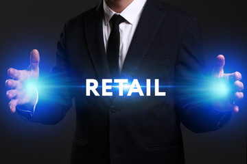 Business, Technology, Internet and network concept. Young businessman working on a virtual screen of the future and sees the inscription: Retail