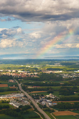 Landscape with a rainbow of mountains, village houses. A view of the earth from the sky. Shooting with copter. France
