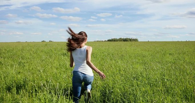 Happy Beautiful Girl Runs on a Grass in the Field, 4K (Canon EOS 5D Mark IV)