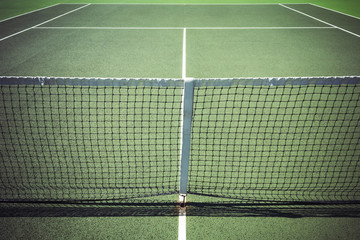 View down centre of tennis court on all weather surface
