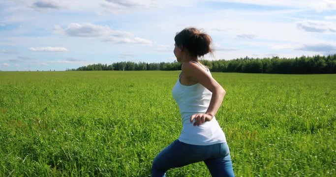Happy Beautiful Girl Runs on a Grass in the Field, 4K (Canon EOS 5D Mark IV)