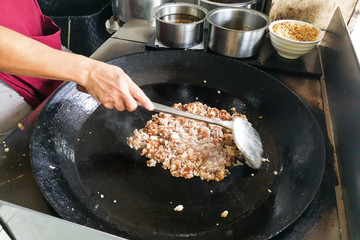 Hawker frying cooking fried carrot cake or kueh kak