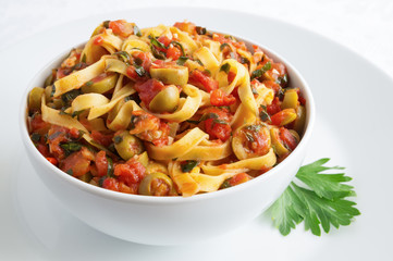 tagliatelle with sauce of tomatoes, herbs, olives, and garlic