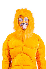 Close-up portrait of smiling and fooling around animator in lion theater role. Plush lion suit. Emotional and colorful portrait. Isolated background