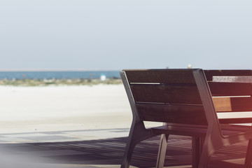 Wooden Bench Located Near Sea with Blue Sky and Sea View