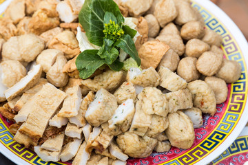 Close-up on plate of fish ball fish cakes for steamboat dining