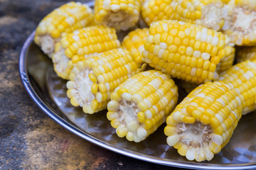 Plateful of fresh sweet organic corn steamed ready to eat