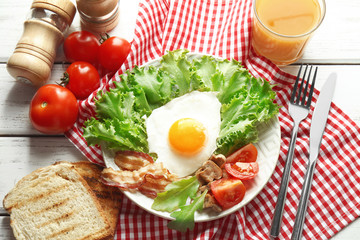 Tasty breakfast with egg on plate