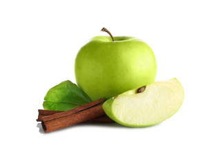 Composition with fresh apples and cinnamon on white background