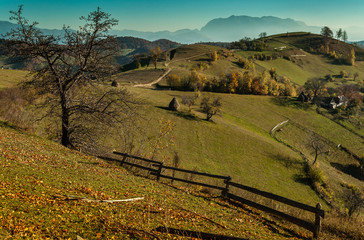 A landscape with hills and mountains of Holbav, Romania in a autumn day