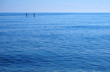 Paddle boarding in the horizon