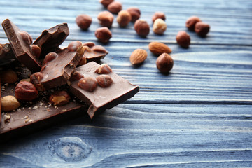 Dark chocolate pieces on wooden table