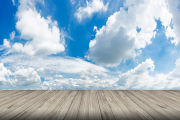 Wood floor against cloudscape