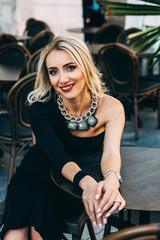 portrait of beautiful smiling girl with blonde hair