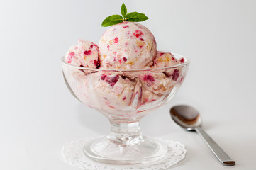 Gelato,  white icecream with raspberries and mint leaves