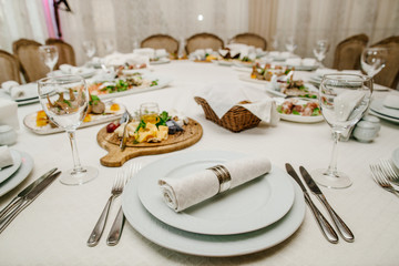 Table with different gourmet cuisine on a white background