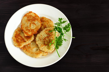 Draniki on a plate. Traditional Ukrainian and Russian cuisine.