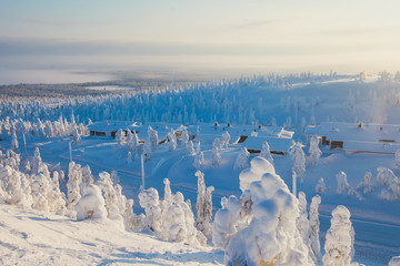 Beautiful cold mountain view of ski resort, sunny winter day with slope, piste and ski lift
