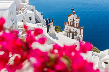Wedding couple and red flowers