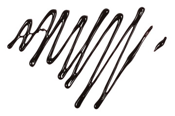 Hot melted chocolate pouring isolated on white background, top view