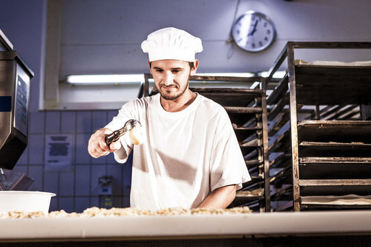 Confectioner making almond cookies