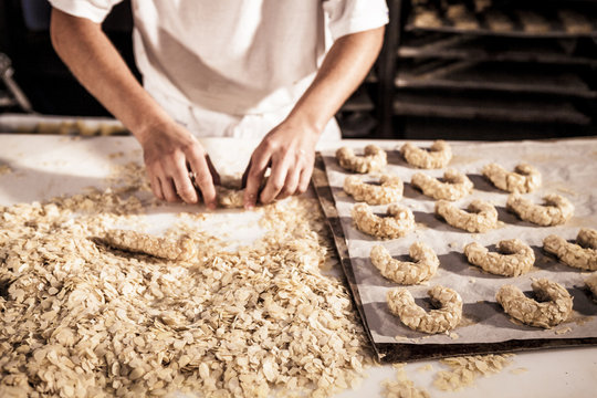 Confectioner making almond cookies