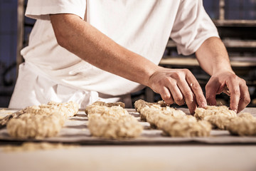 Confectioner making almond cookies