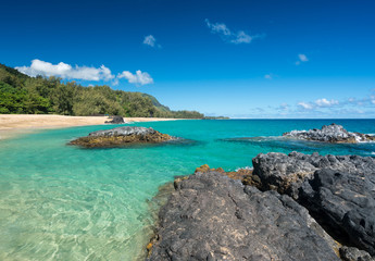 Fototapeta na wymiar Lumahai Beach Kauai with rocks