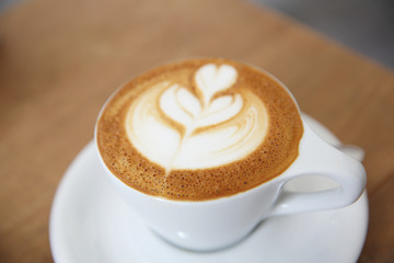 cappuccino coffee on wood background