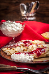 Rolled crepes stuffed with cottage cheese.