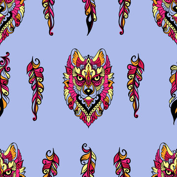 Seamless pattern with wolf and feathers in ethnic style - colorful art on a blue background