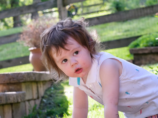 Young girl having fun outdoors in the back yard
