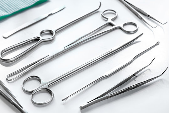 Medical instruments for cosmetic surgery on white table backgrond