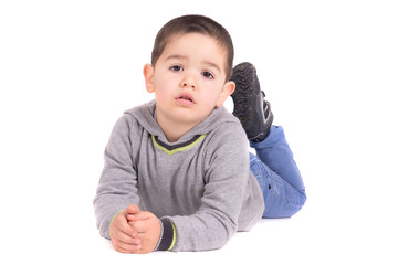 little boy posing isolated in white
