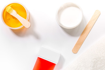 Concept depilation with wax and sticks on white background top view