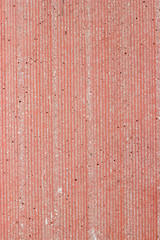 Red cement texture of the relief wall