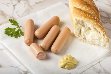 Sausages (Frankfurter) with bread and mustard