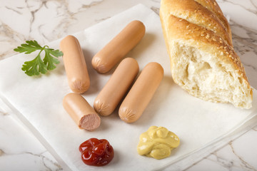 Fototapeta na wymiar Sausages (Frankfurter) with bread, mustard and ketchup