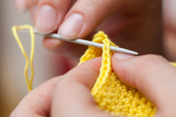 Woman hands and needle