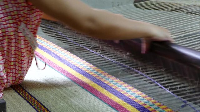 Weaving a matras in Hoi An Vietnam
