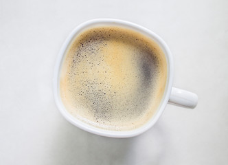 Cup of coffee espresso on white background, top view. Black americano isolated on white
