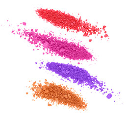 Set of crushed colored eyeshadows on white background