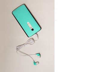 Concept of listening music from smartphone with wireless technology with white box inscription