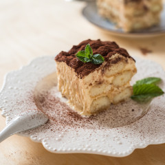 Tiramisu coffee cake served on a white plate