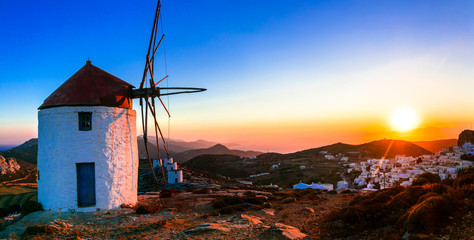 Idyllic landscape with windmills over sunset. Amorgos isalnd, Greece