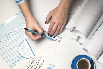 Architect working on blueprint.